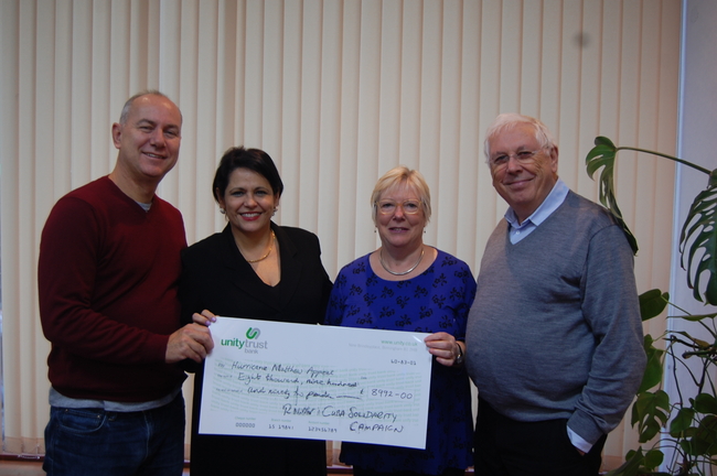 CSC director Rob Miller with executive members Carol and Bernard Regan delivering a cheque to Cuban ambassador HE Teresita Vicente 