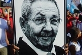 A person carries a picture of Cuban President Raul Castro during a May Day rally in Havana.
