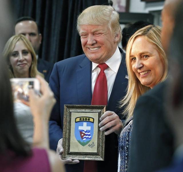 Donald Trump receives the Shield of Brigade 2506 at the Bay of Pigs Museum in Miami on Oct. 25 2016 as presidential candidate