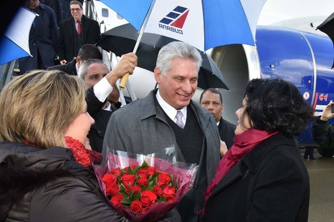 Cuban President Miguel Diaz-Canel is greeted at the airport by Cuban Ambassador Teresita Vicente