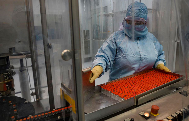 Technician Mayelin Mejias works with the 'Soberana 02' COVID-19 vaccine at the packaging processing plant of the Finlay Vaccine Institute in Havana, Cuba, Jan. 20, 2021. The director of the Finlay Ins