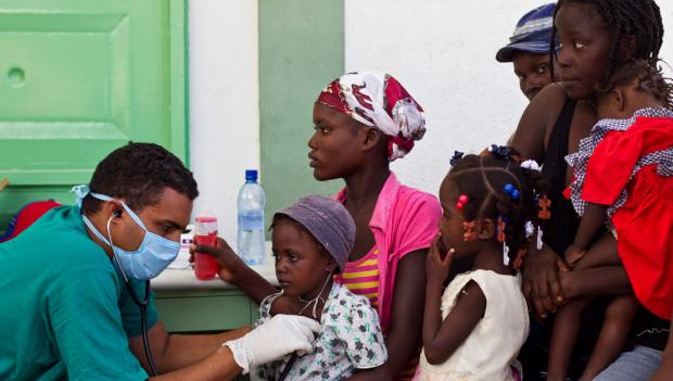 Cuban doctor treats cholera patients in a hospital in L'Estere, Haiti