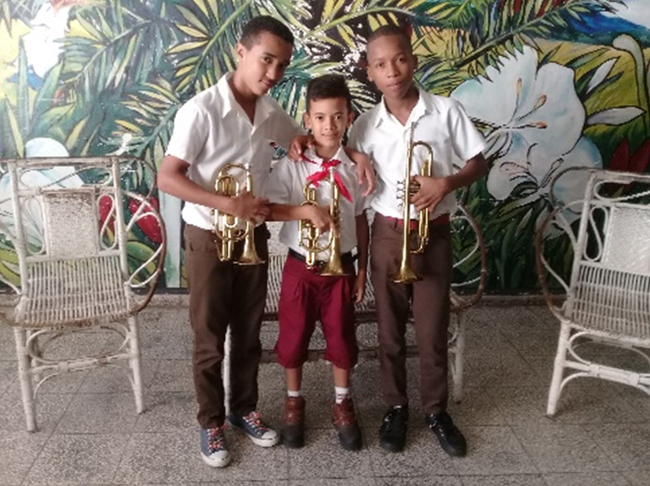 Three trumpet players at the El Cucalambé School of Performing Arts in Las Tunas