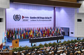 Cuban President Miguel Diaz Canel (L) speaks during the inaugural session of the G77+China Summit at the Convention Palace in Havana on September 15, 2023