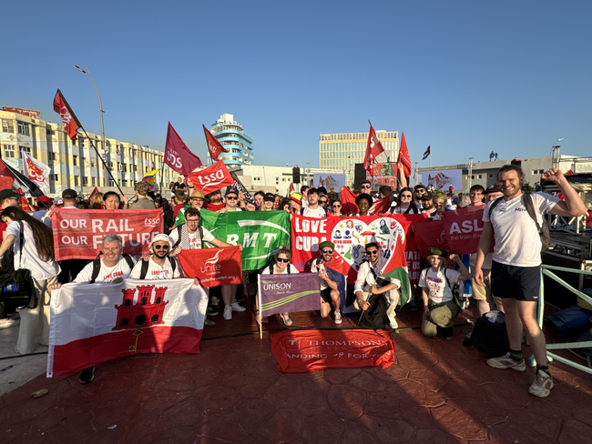 Alex Tarrier, right, with other brigadistas at the May Day Rally in Havana