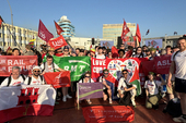 Alex Tarrier, right, with other brigadistas at the May Day Rally in Havana