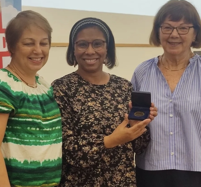 Cuban Ambassador Ismara Vargas Walter  presenting Trish Meehan and Dodie Weppler with a  special award for their work on Screen Cuba