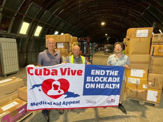 Rob Miller CSC director with staff at Jacob's Well packing the third consignment of medical aid for Cuba