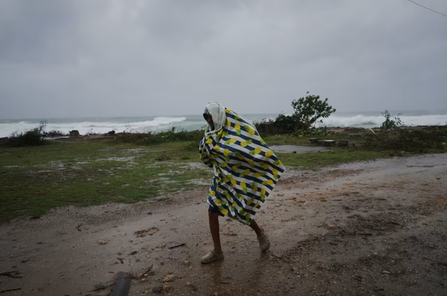Man walks near Santiago de Cuba on 28 October, just before Melissa makes landfall Man walks near Santiago de Cuba on 28 October, just before Melissa makes landfall