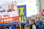 Cubans file past the US Embassy on January 16 holding a banner: ‘Listen Rubio, listen Trumpeta (Loudmouth) stop hussling us, our people will be respected’