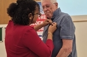 Bernard Regan receiving the Medal of Friendship
